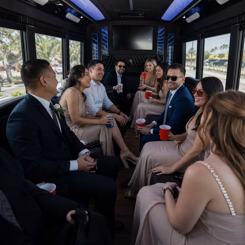 Wedding guests seated inside a Oxnard party bus