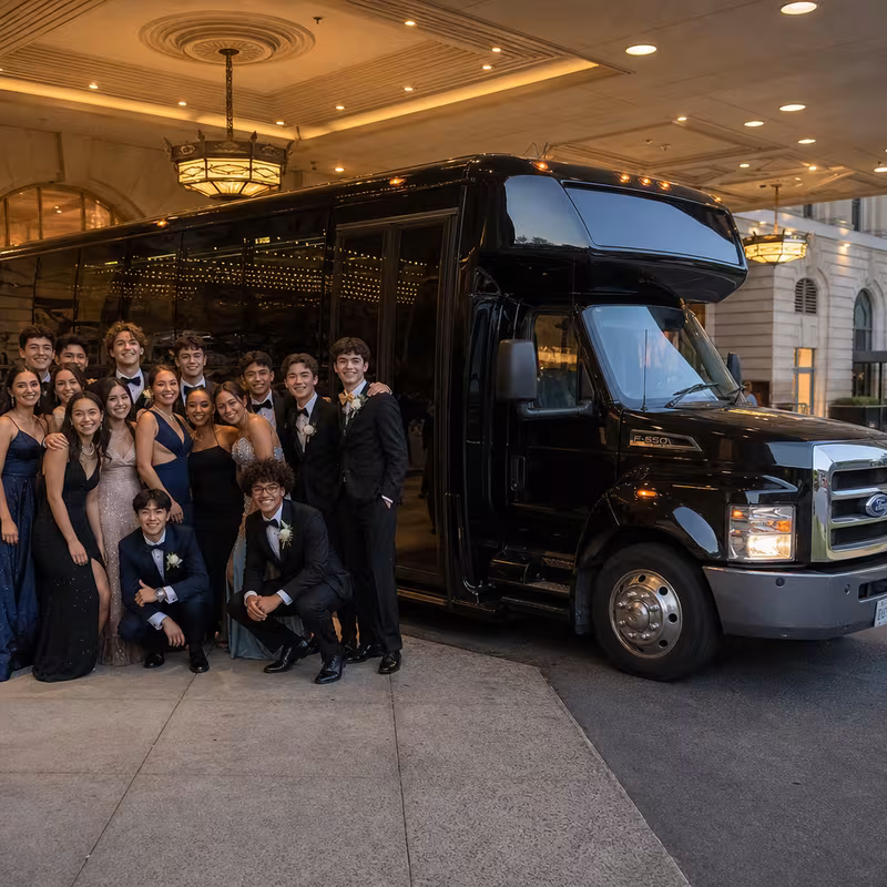 Party bus interior with wraparound leather seating and LED lighting in Oxnard